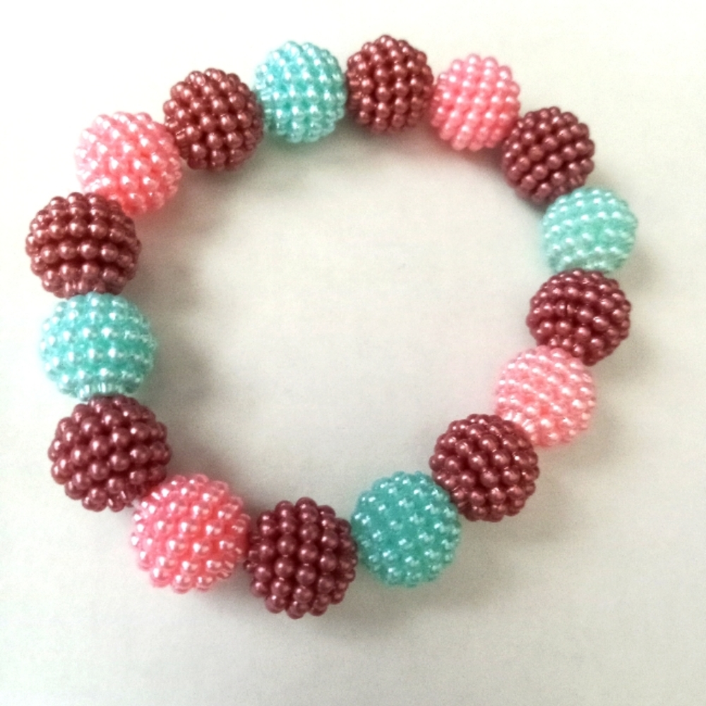 Hand crafted New iridescent pearl pastel beaded raspberry statement Bracelet